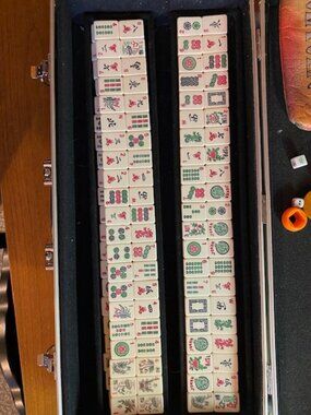 Mahjong set complete with 180 tiles steel case with wheels maybe from the 60's?